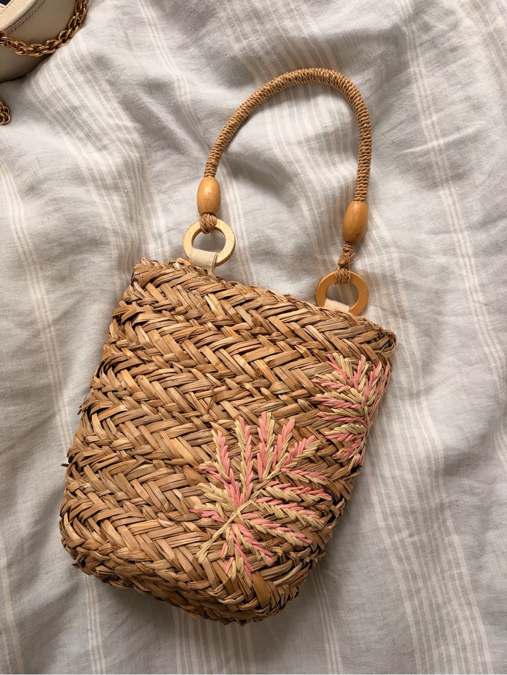 L*Space Woven Straw Bucket Bag with Pink Leaf Embroidery